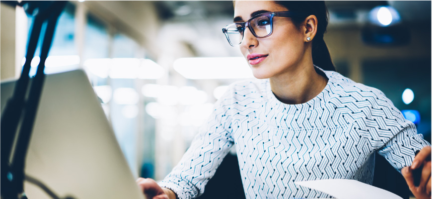 Woman looking at laptop